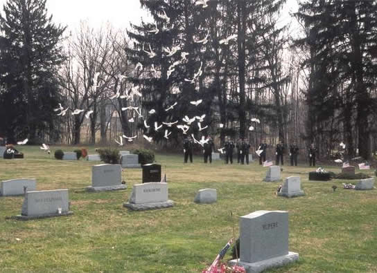 flock of doves at memorial service